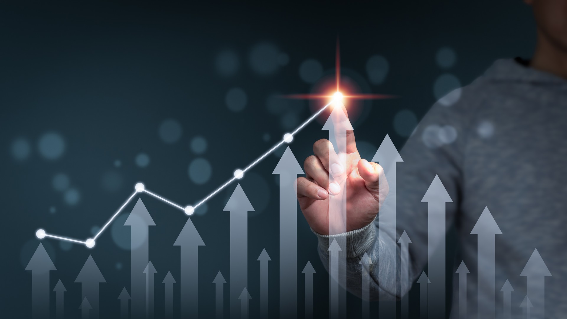 A businessman shows an arrow graph that depicts the company's future growth strategy and percentage increase. The idea is to start a business from the ground up in order to succeed and grow.